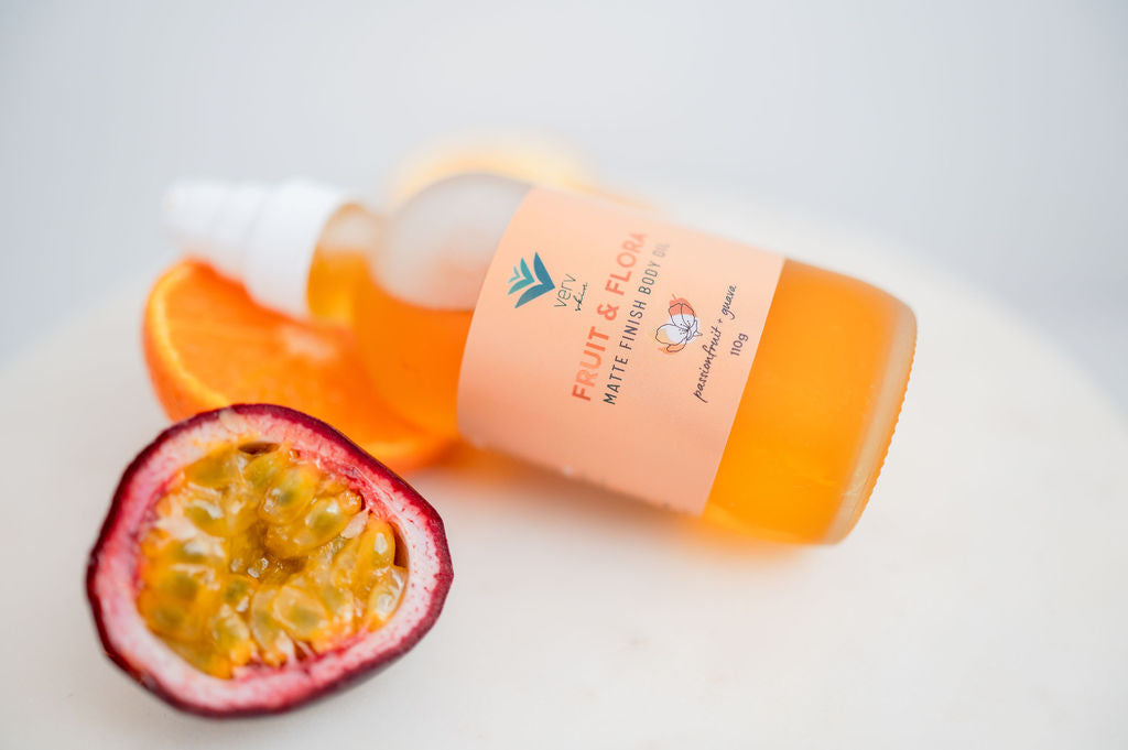 Passionfruit and Guava Body Oil with an open passionfruit in the foreground