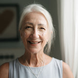 Smiling older woman with gray hair in a casual setting