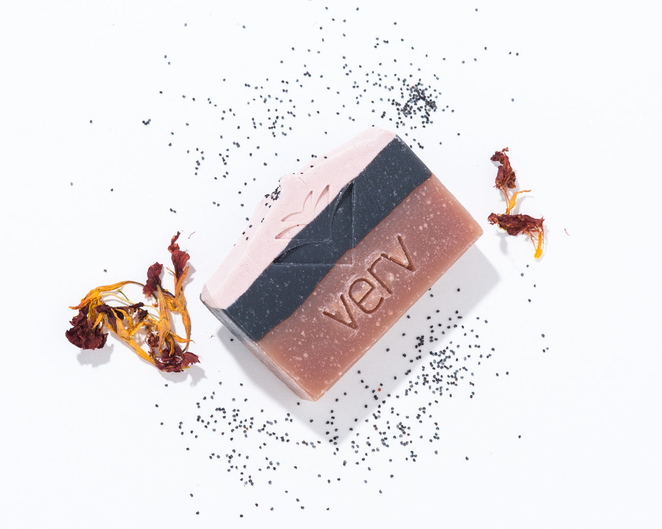 The Artist Soap bar without packaging. Scented with earthy patchouli and fragrant lavender with a hint of rich clove oil. 